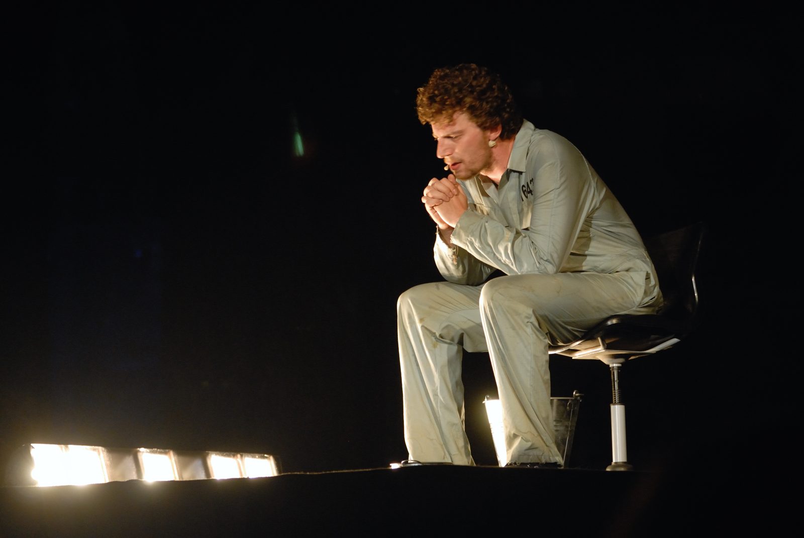 The Unseen, three prisoners on stage