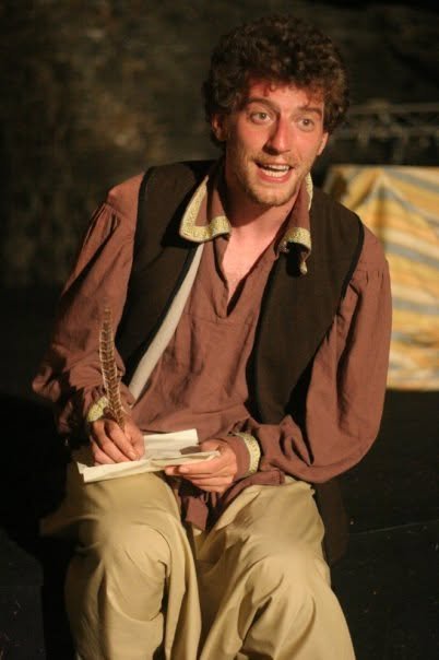 La XII Notte, a man writing a letter